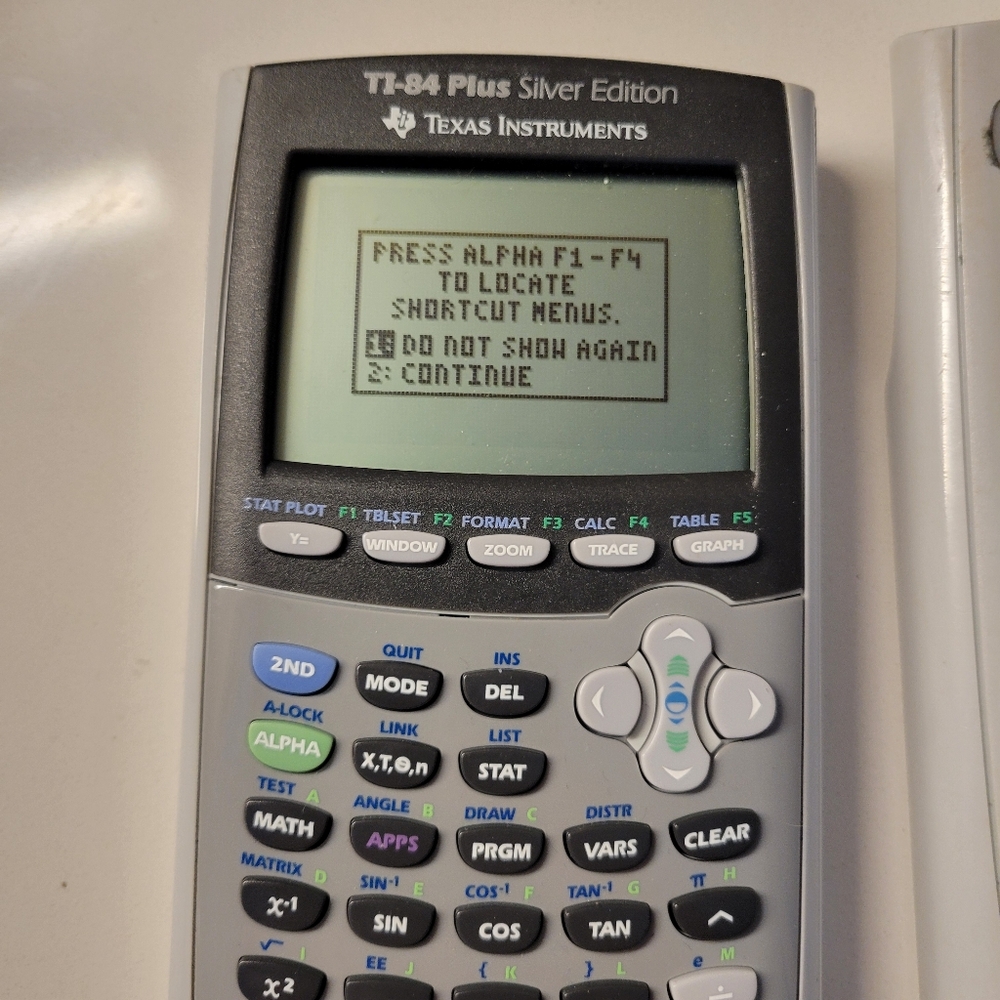 Texas Instruments TI-84 Plus Silver Edition Graphing Calculator with cover
